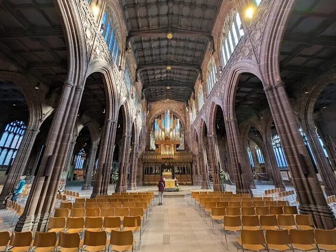 Families enjoying Winter Wonderland at Manchester Cathedral with festive rides and Christmas decorations