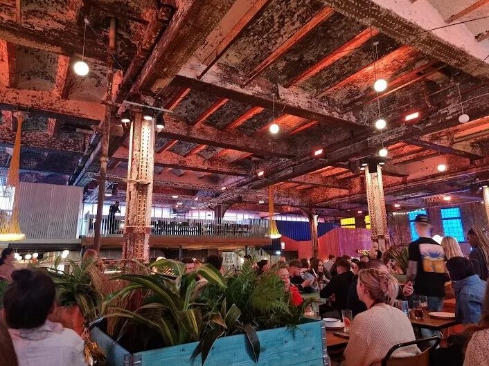 Families enjoying the Manchester Christmas Fair at Mayfield Depot with festive rides and market stalls