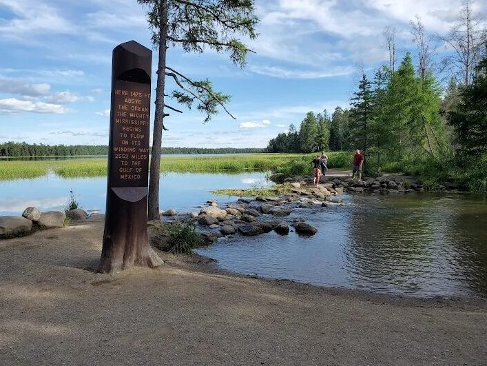 Scenic view of the Mississippi River headwaters surrounded by trees in Itasca State Park, Minnesota