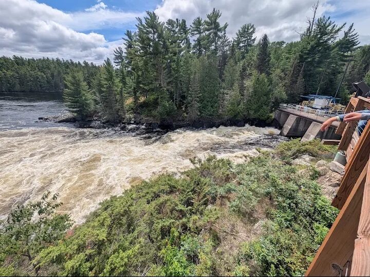 Sunset over the lake with boats and pine covered islands at Voyageurs National Park in northern Minnesota
