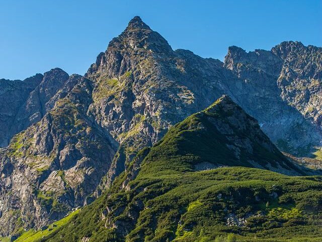 Snow capped Tatra Mountains with pine forests and a scenic hiking trail in southern in Poland